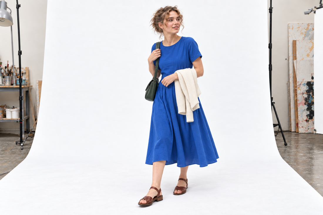 Cobalt dress, brown flat sandals, dark green bag and cream cardigan for Chelsea